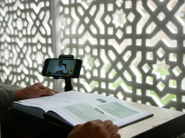 Person viewing a virtual property walkthrough on a tablet